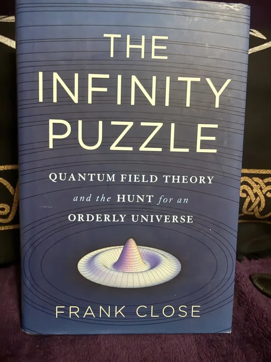 The Infinity Puzzle — front cover (TOTM-BK-040)